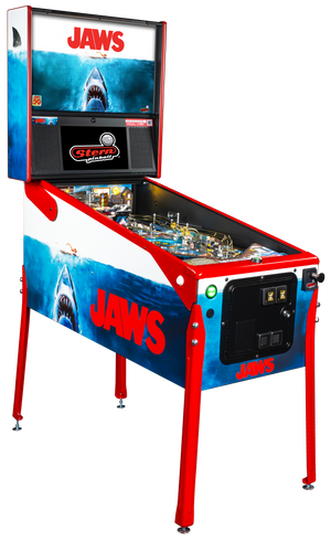 Pinball machine themed after the movie 'Jaws' with shark graphics and red, white, and blue colors.